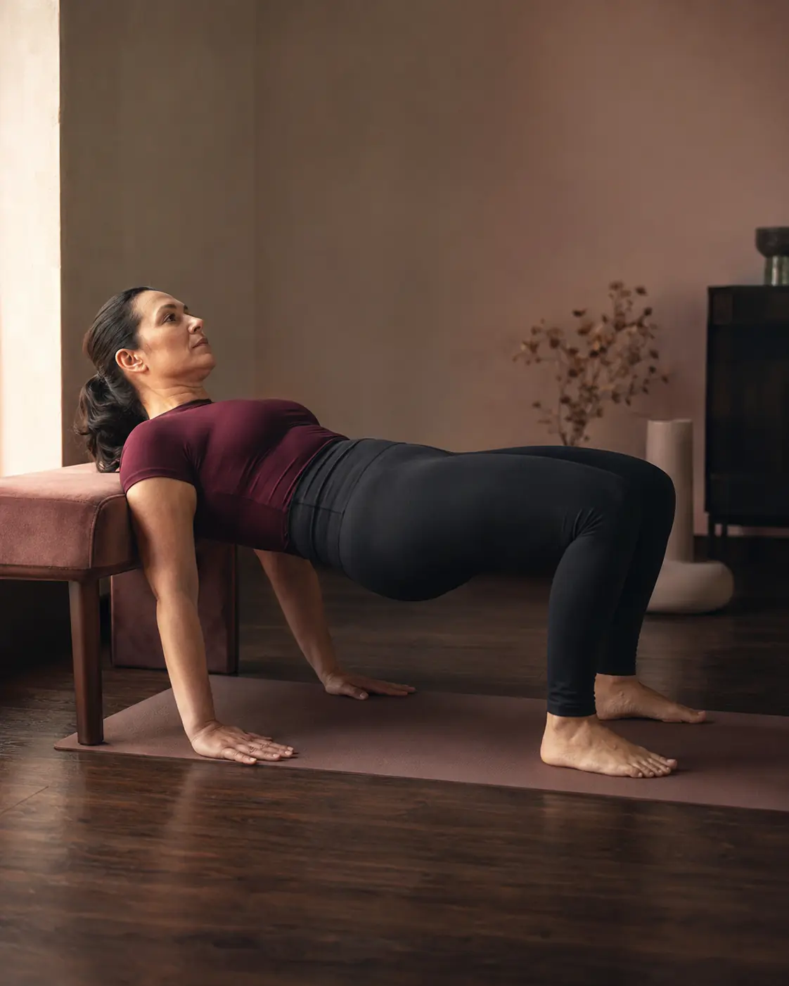 Woman rebuilding strength with a controlled hip exercise